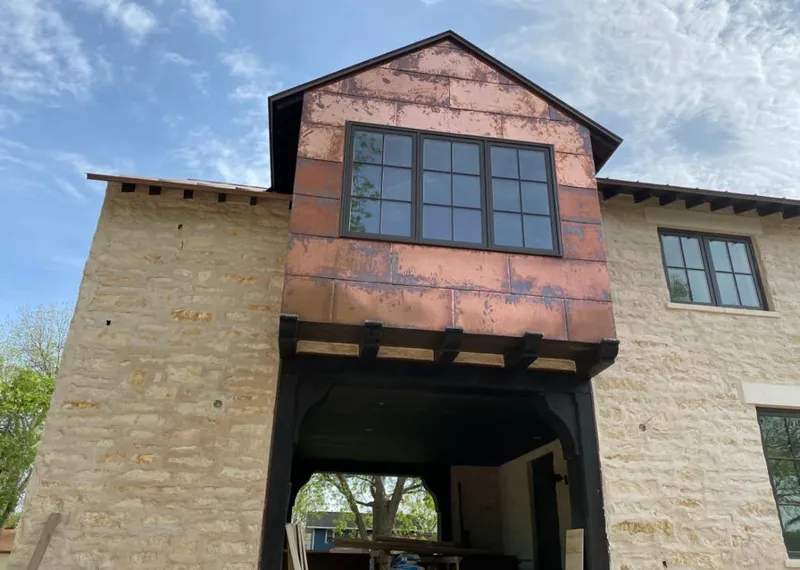 Copper metal panel facade on a stone building for Skylight Installation in Kahaluu-Keauhou